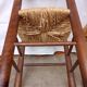 Brutalist chairs in walnut and straw