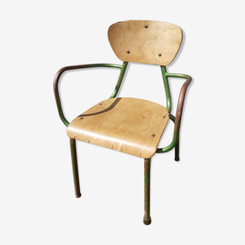 Former green metal child chair
