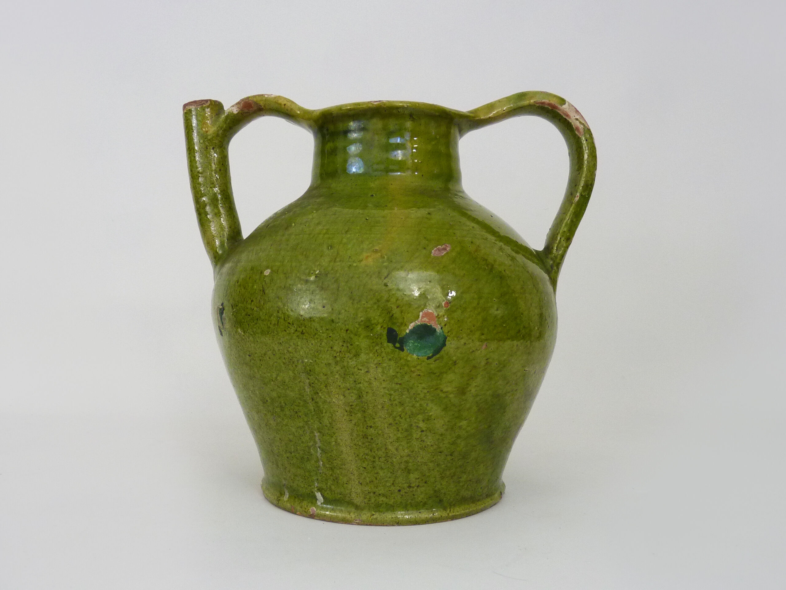 Orjol water pitcher pottery in green glazed terracotta. Pyrenees XIXth