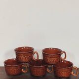 Caramel brown ceramic mugs with geometric flower pattern from the 70s