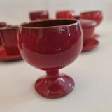Red enamelled terracotta: cups, saucers, glasses
