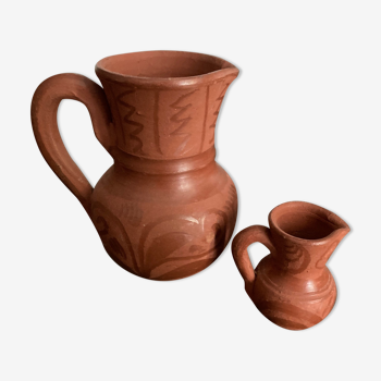 Two pottery milk jugs