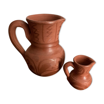 Two pottery milk jugs