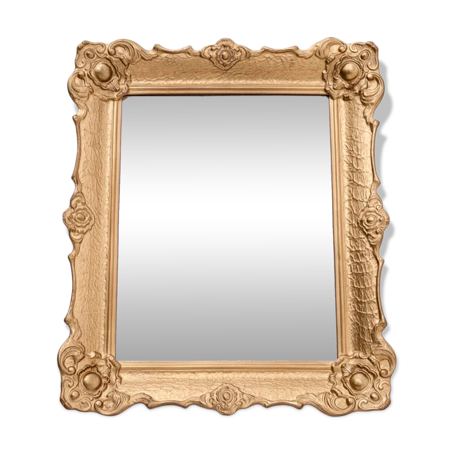 Mirror in a decorative gold frame