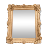 Mirror in a decorative gold frame