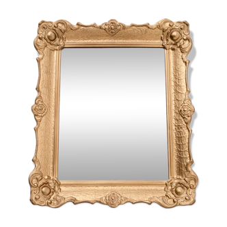 Mirror in a decorative gold frame