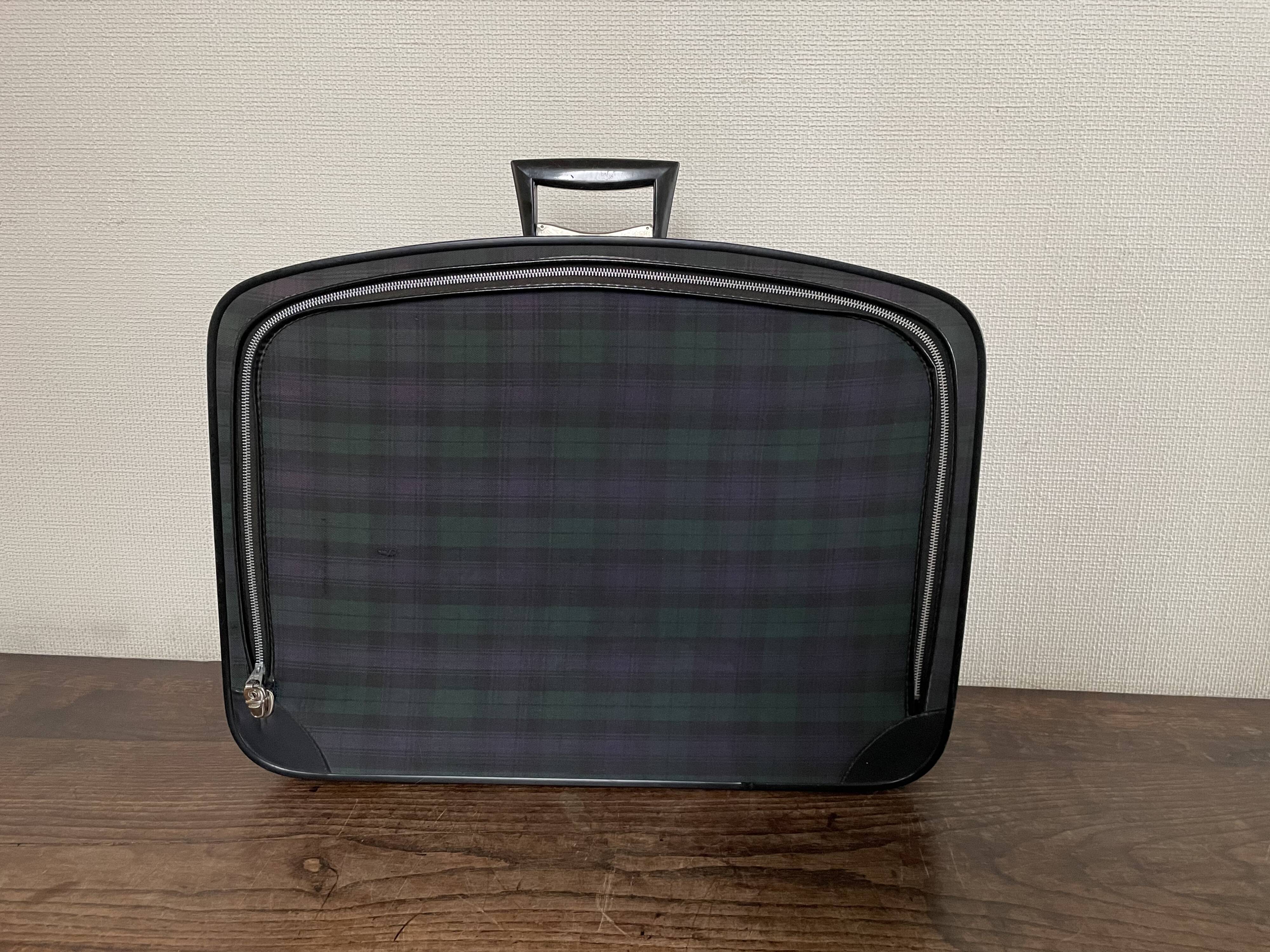 Tartan check suitcase