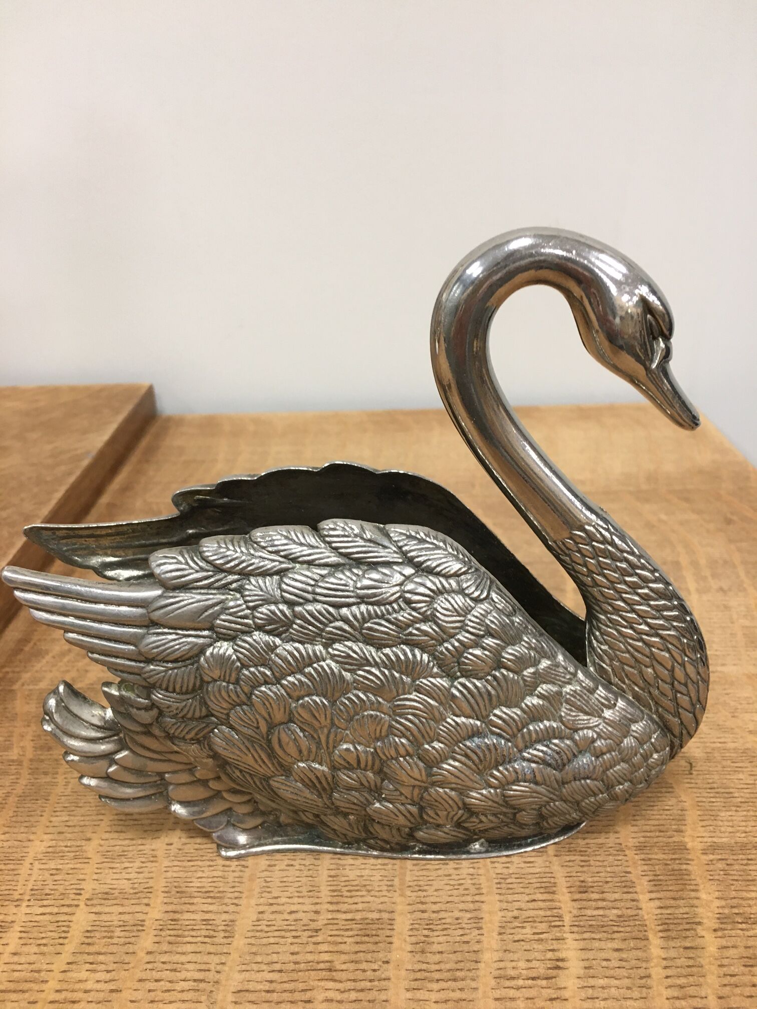 Swan wears silver metal letters