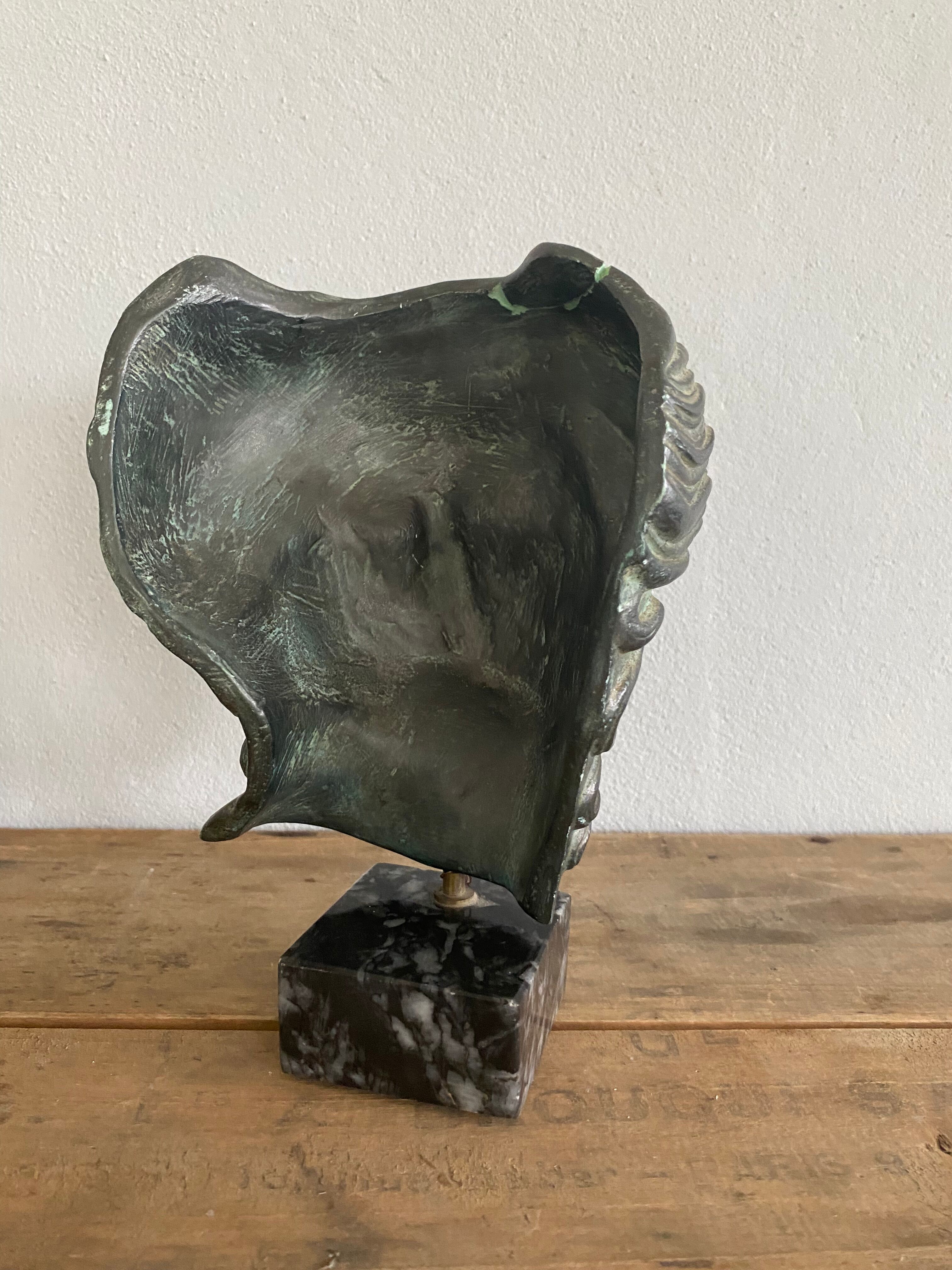 Greek head in patinated plaster with marble base