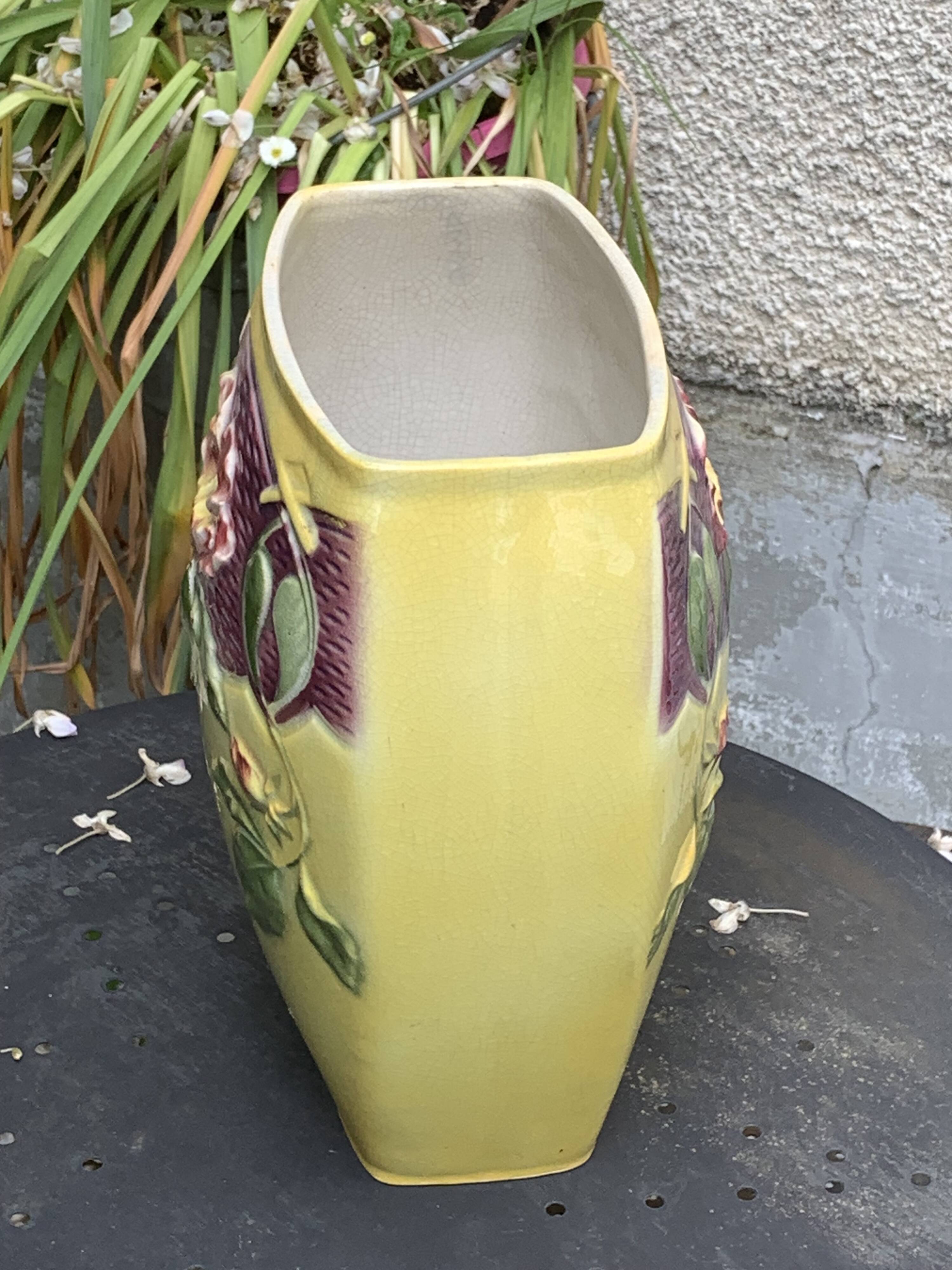 Yellow glazed ceramic slip vase with hawthorn pink flower motif