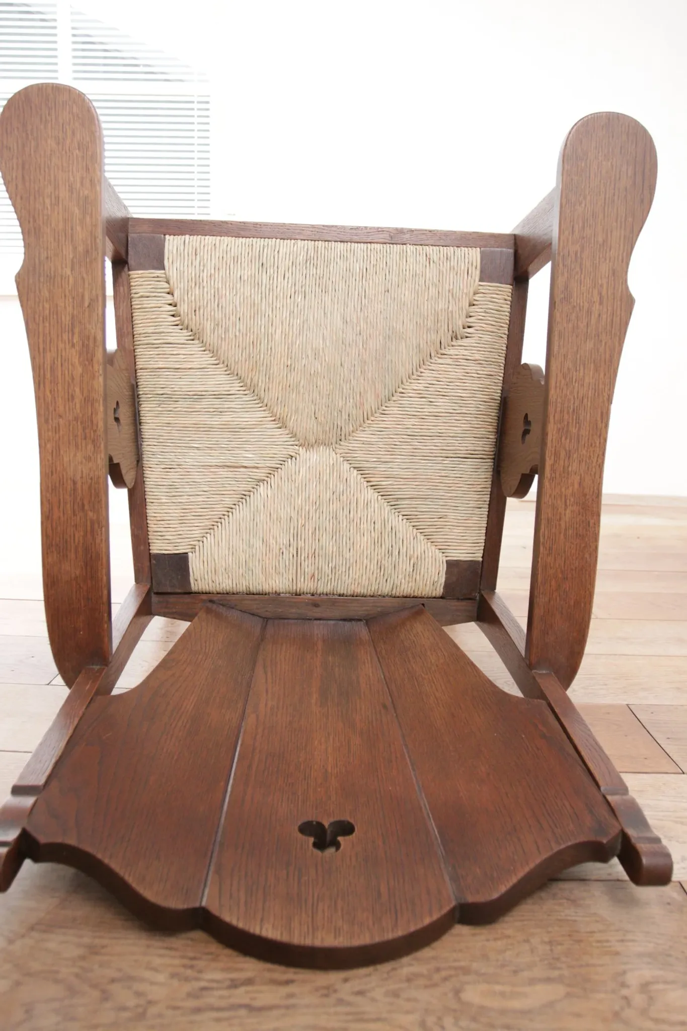 Pair of low Brutalist oak lounge chairs with new rush seats – circa 1935