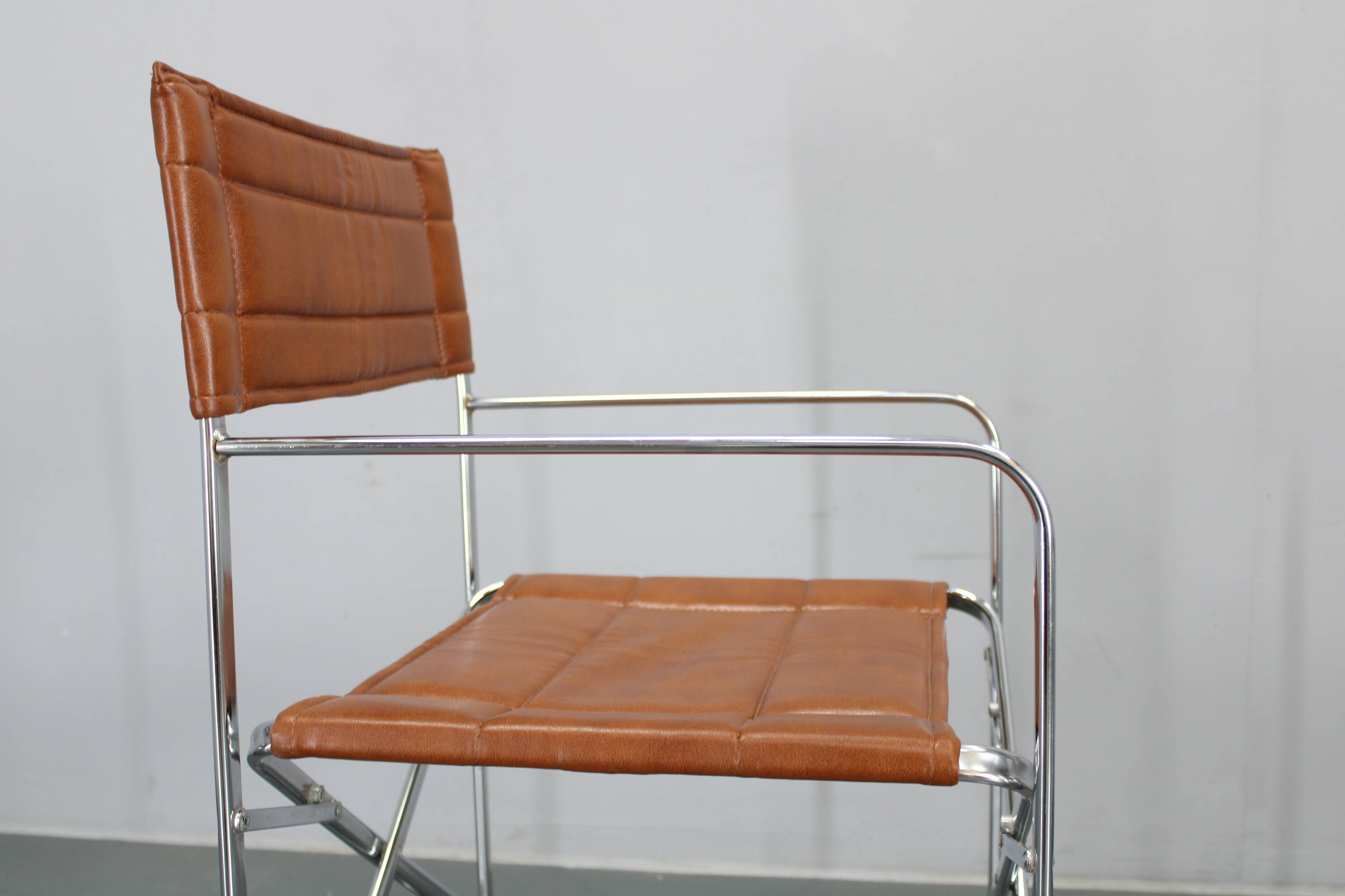 1970s pair of Italian folding chairs with leatherette upholstery