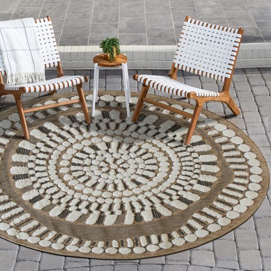Round jute rug with white relief patterns, 90 cm