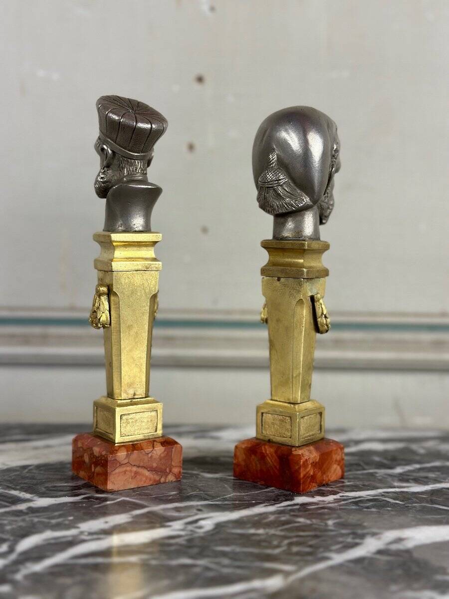 Pair of Abyssinian busts in nickel on gilded bronze and marble bases, 19th century.