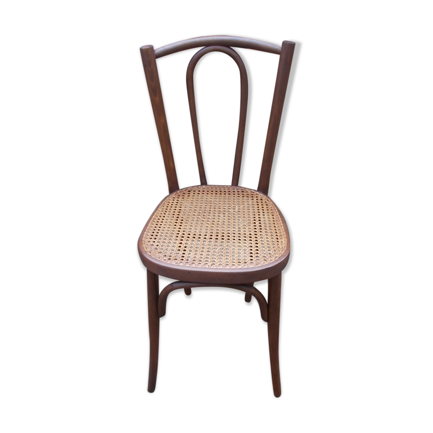 Curved wooden bistro chair with caning