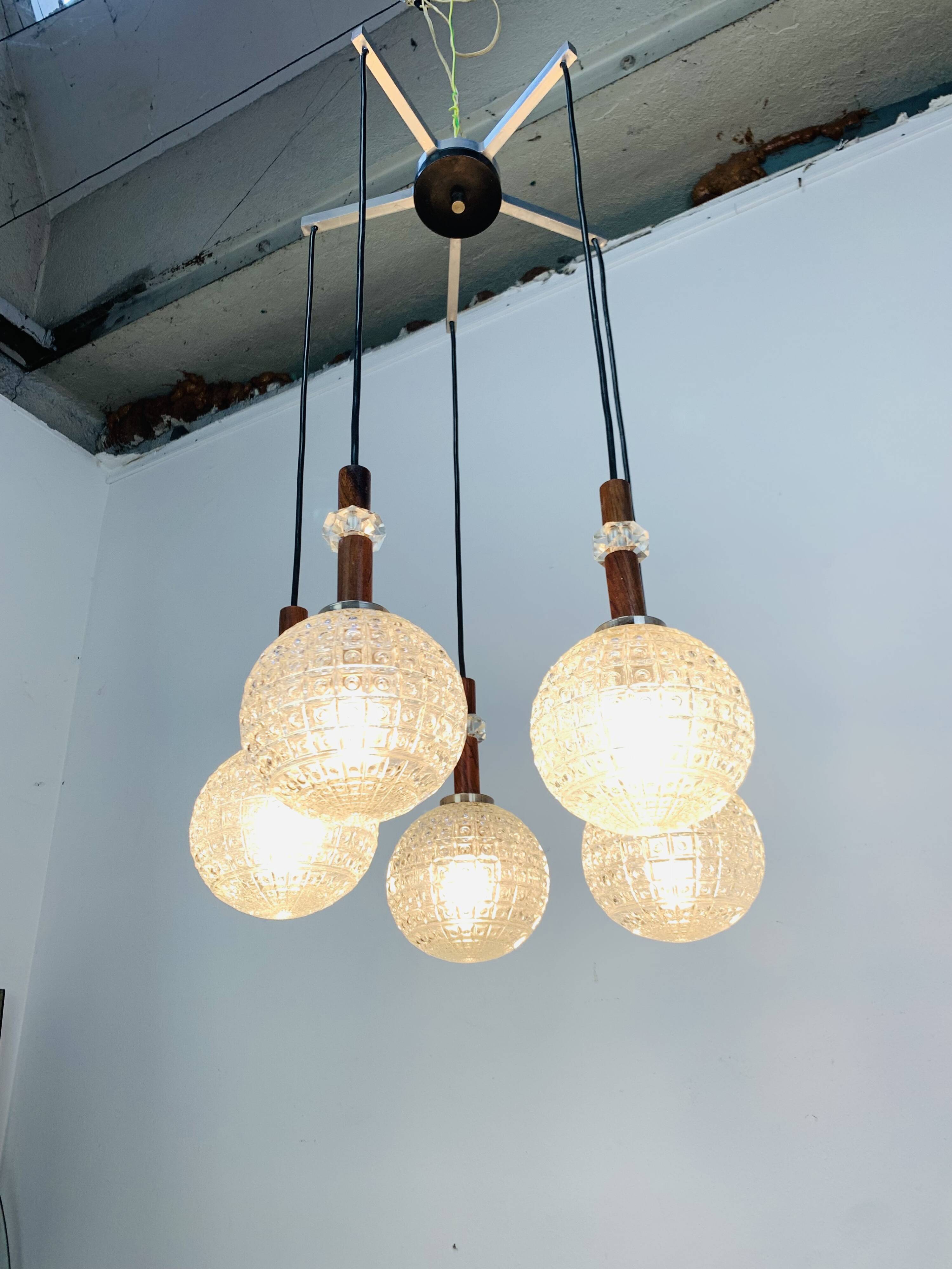Scandinavian suspension cascade, 5 moulded glass globes and teak, 1960s