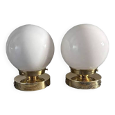 Set of two white globe wall lights