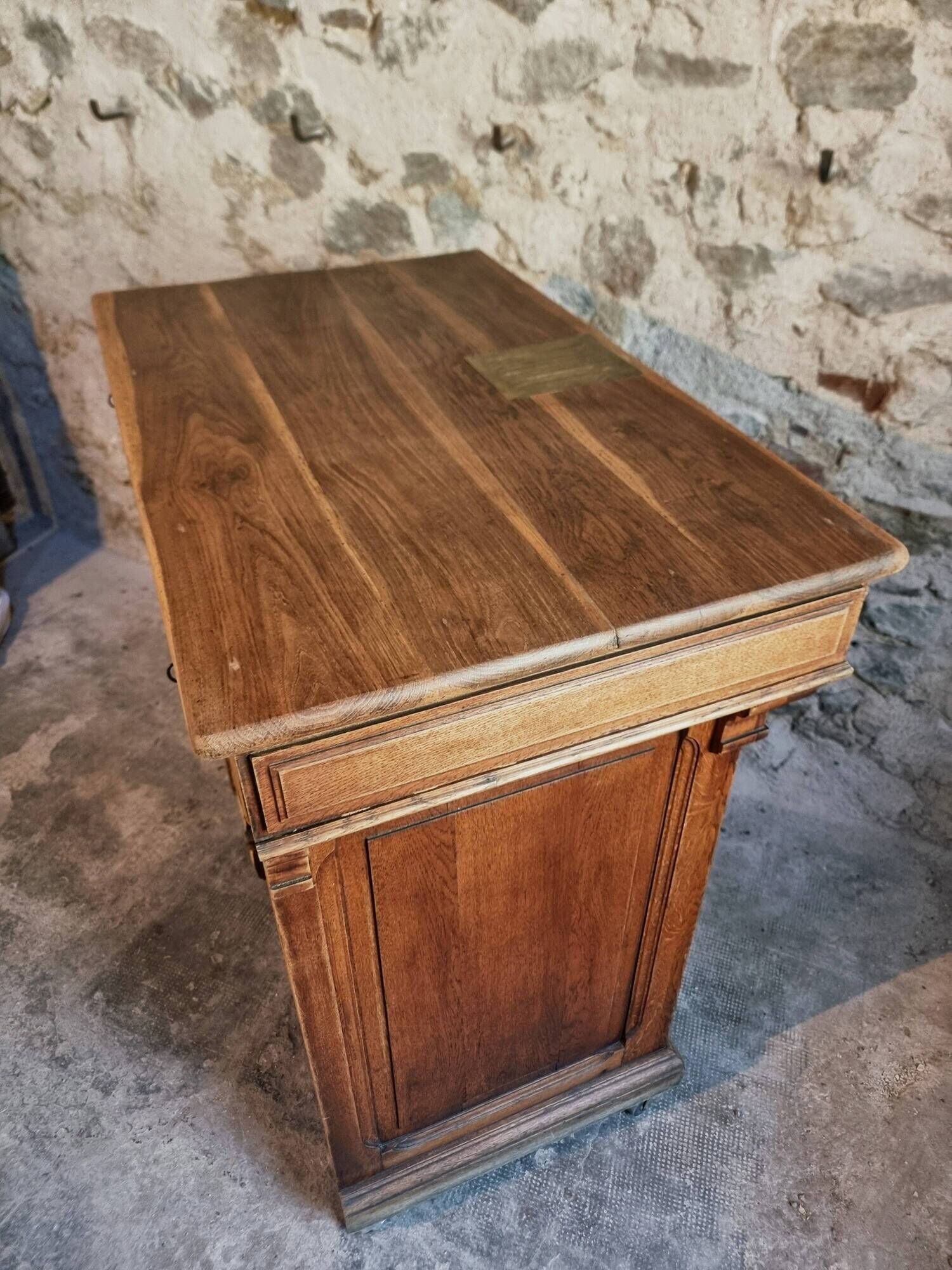 Antique French oak shop counter, kitchen island on wheels, circa 1880–1900.