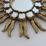 Golden wooden sun mirror with inlays from the early 20th century.