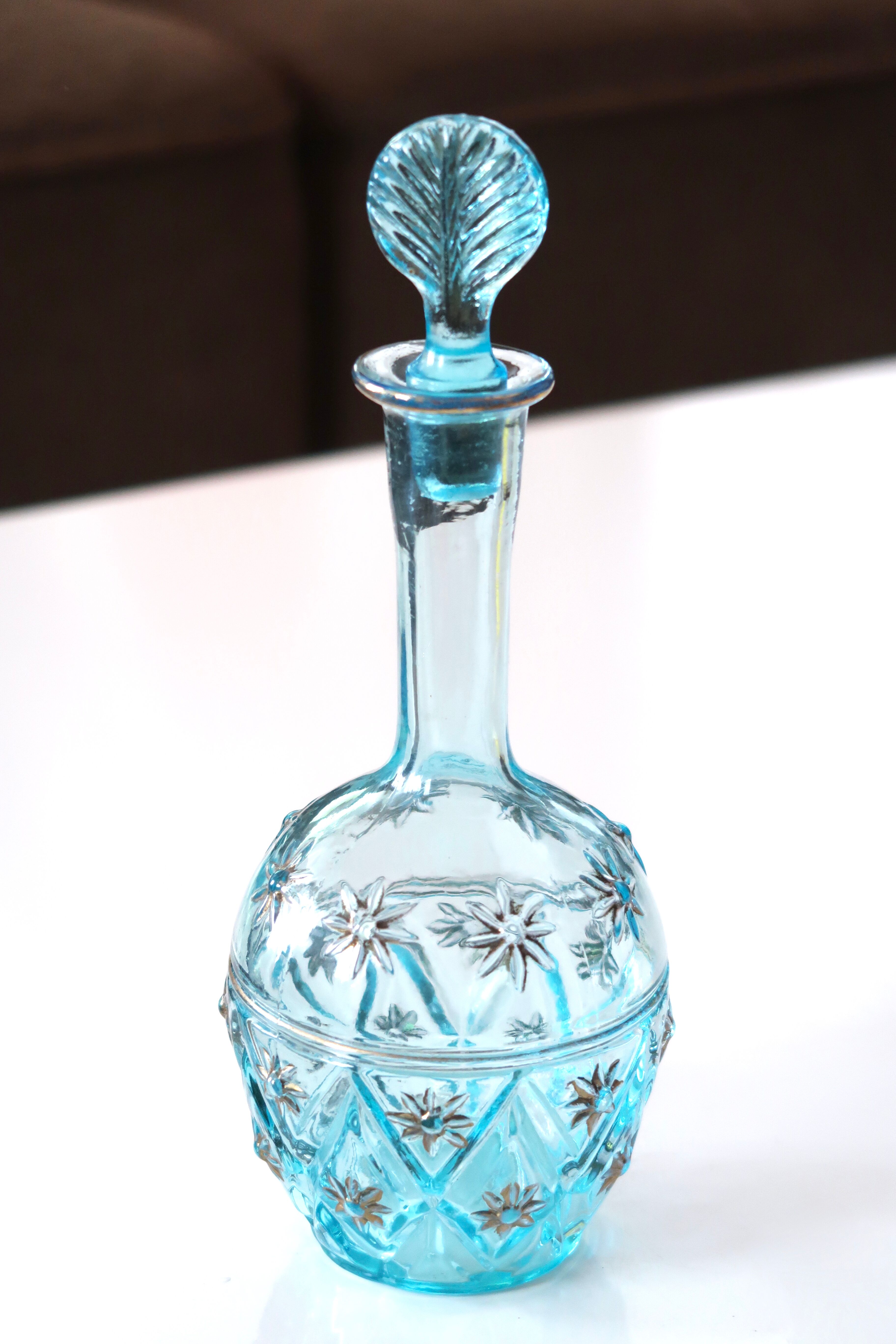Turquoise blue glass decanter, golden décor, 5O years