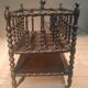Rosewood magazine rack on casters
