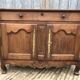 Antique Louis XV low chestnut sideboard with 2 doors and 1 drawer.