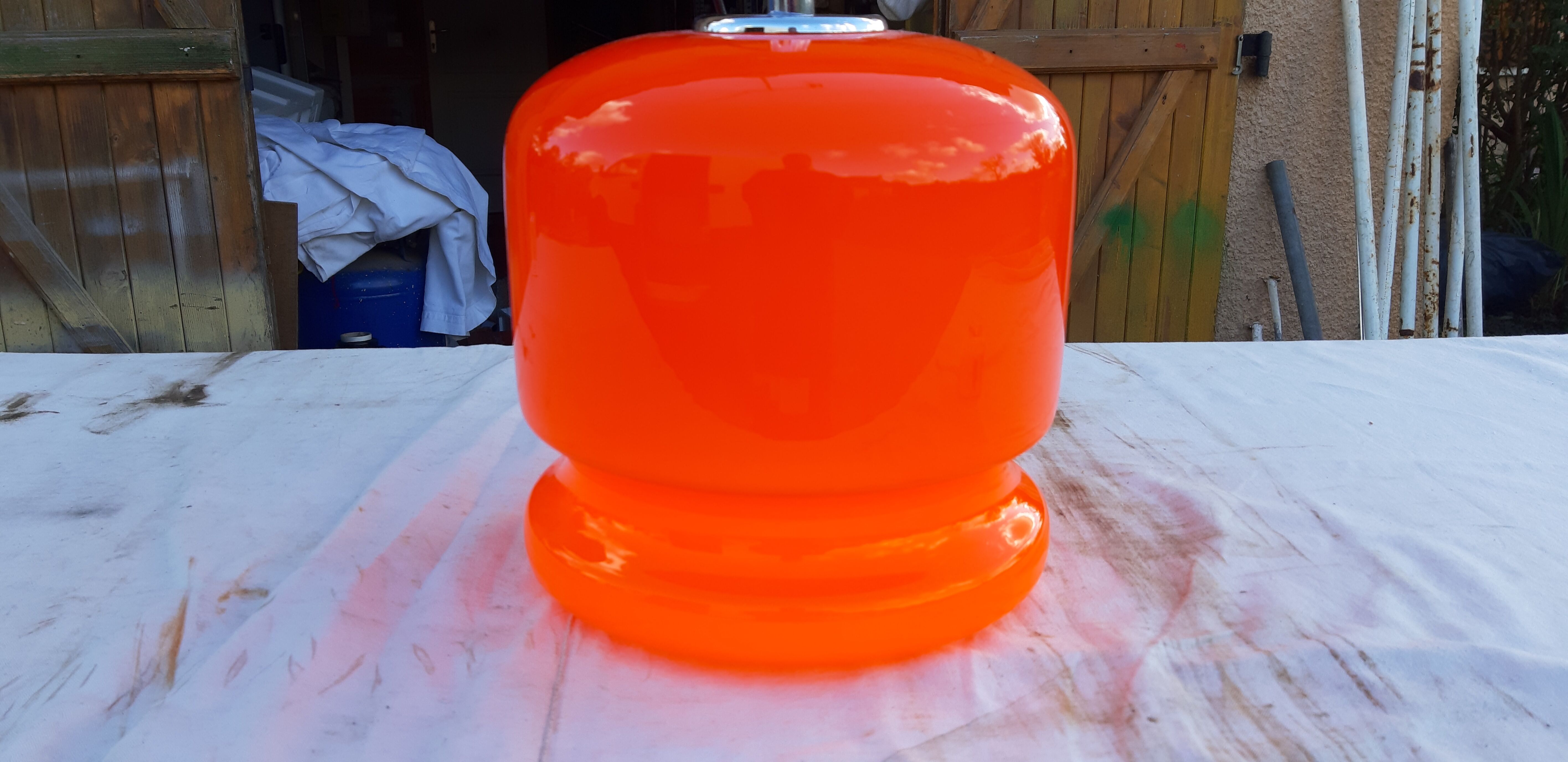 Vintage lamp of the 70s in orange opaline