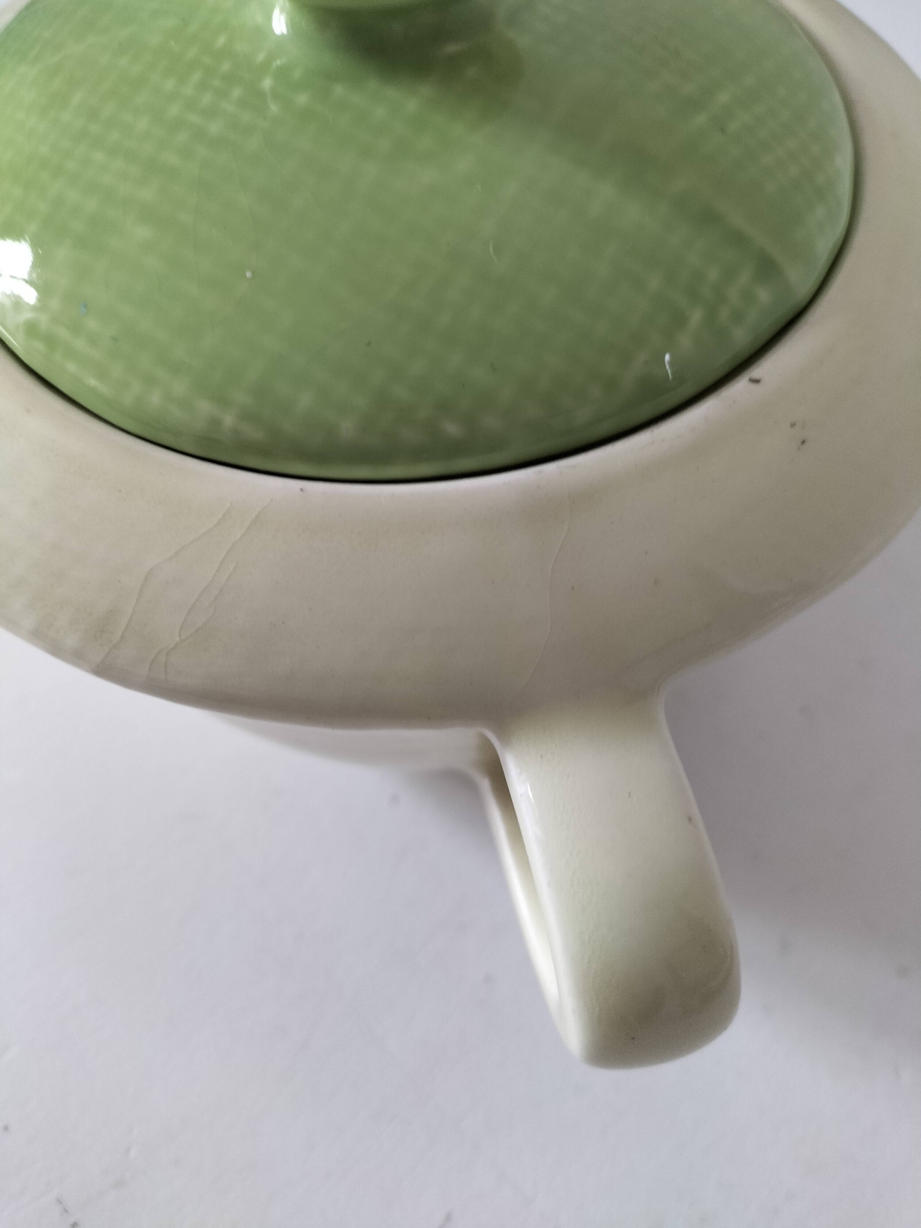 Two sugar bowls and a textured plate in turquoise and green Salins earthenware.