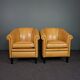 Set de 2 fauteuils club en cuir de mouton blond