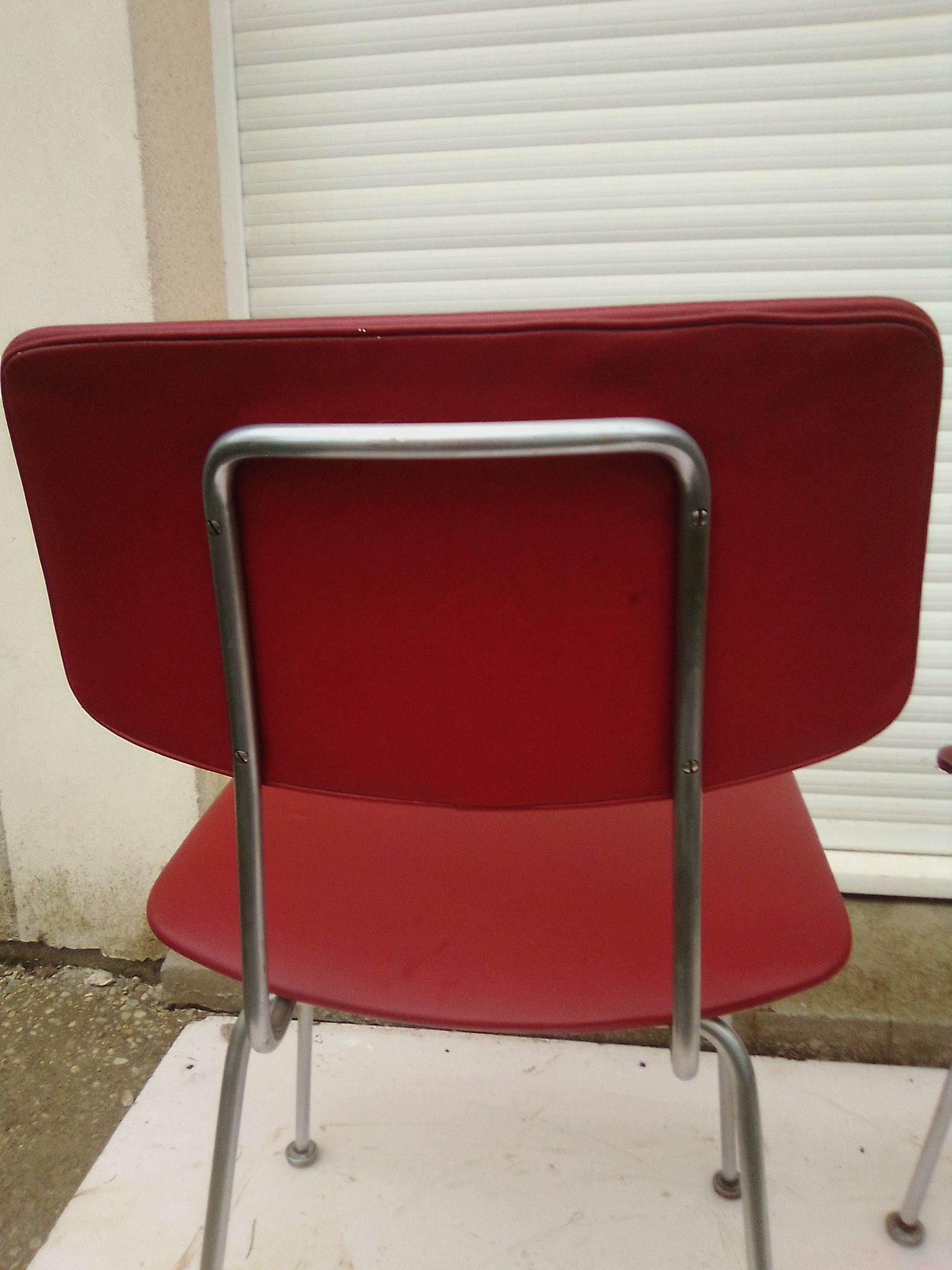 2 chairs in red skaï metal struxture 70s