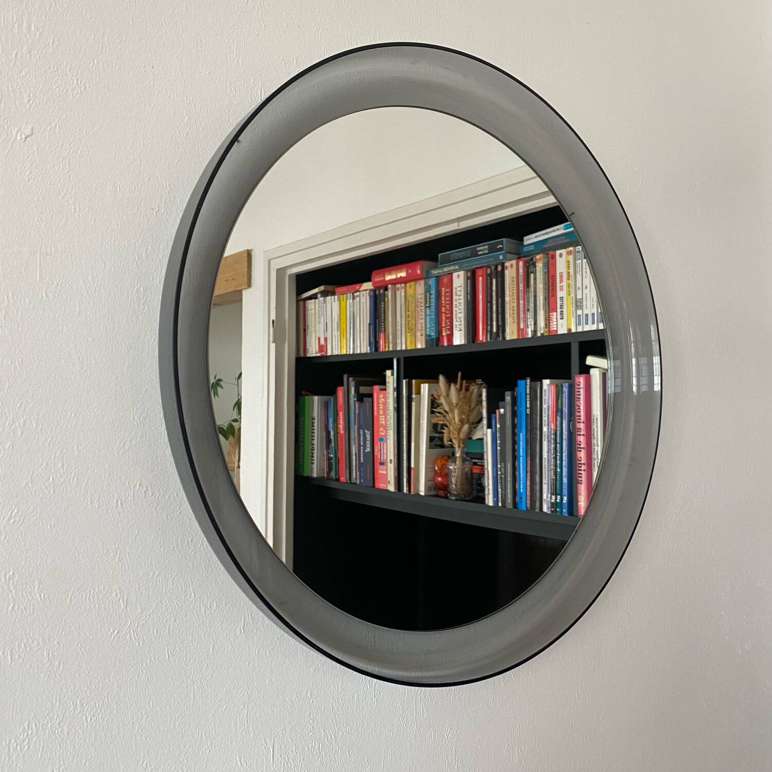 Round bluish plexiglass mirror