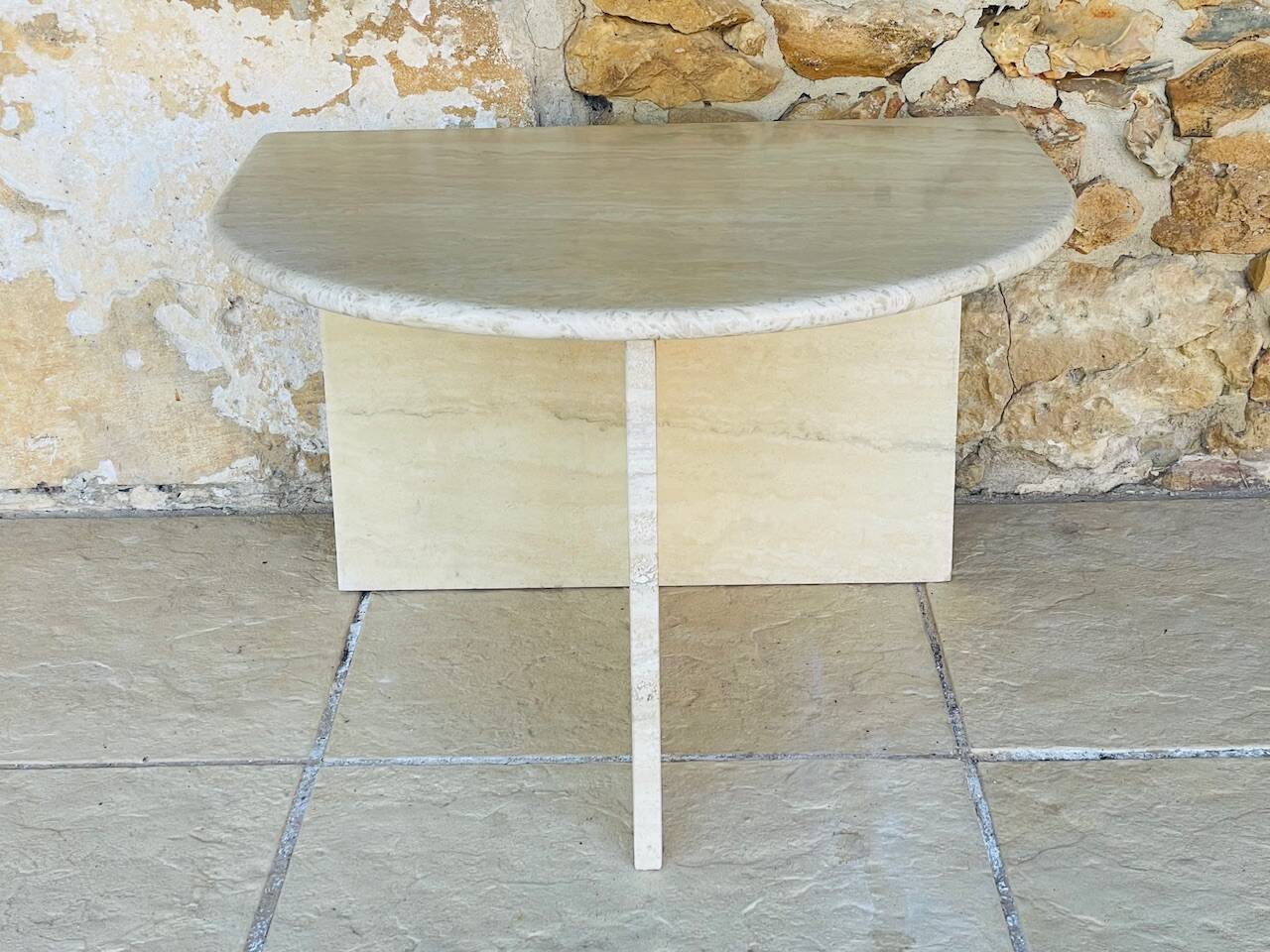 Vintage side table in travertine, circa 1980s.