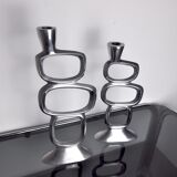 Pair of circle candlesticks by matthew hilton, england, 1980