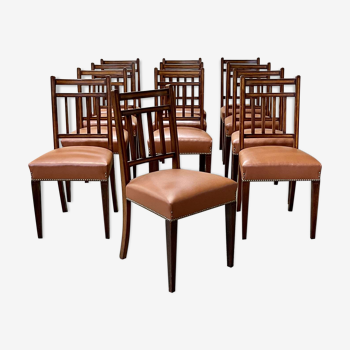 Suite de 12 chaises anglaises XIXème en acajou et simili cuir