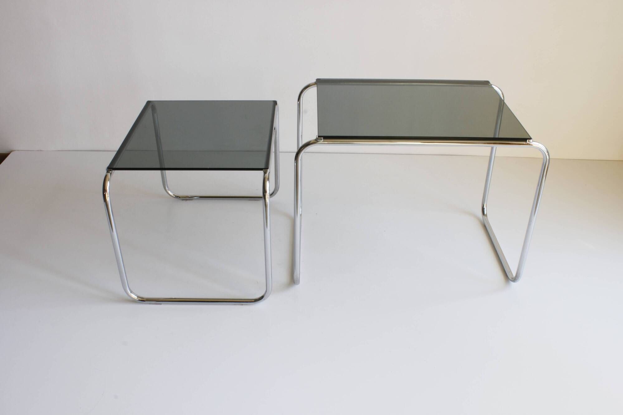 Tubular steel and smoked glass side tables, set of 2
