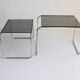 Tubular steel and smoked glass side tables, set of 2