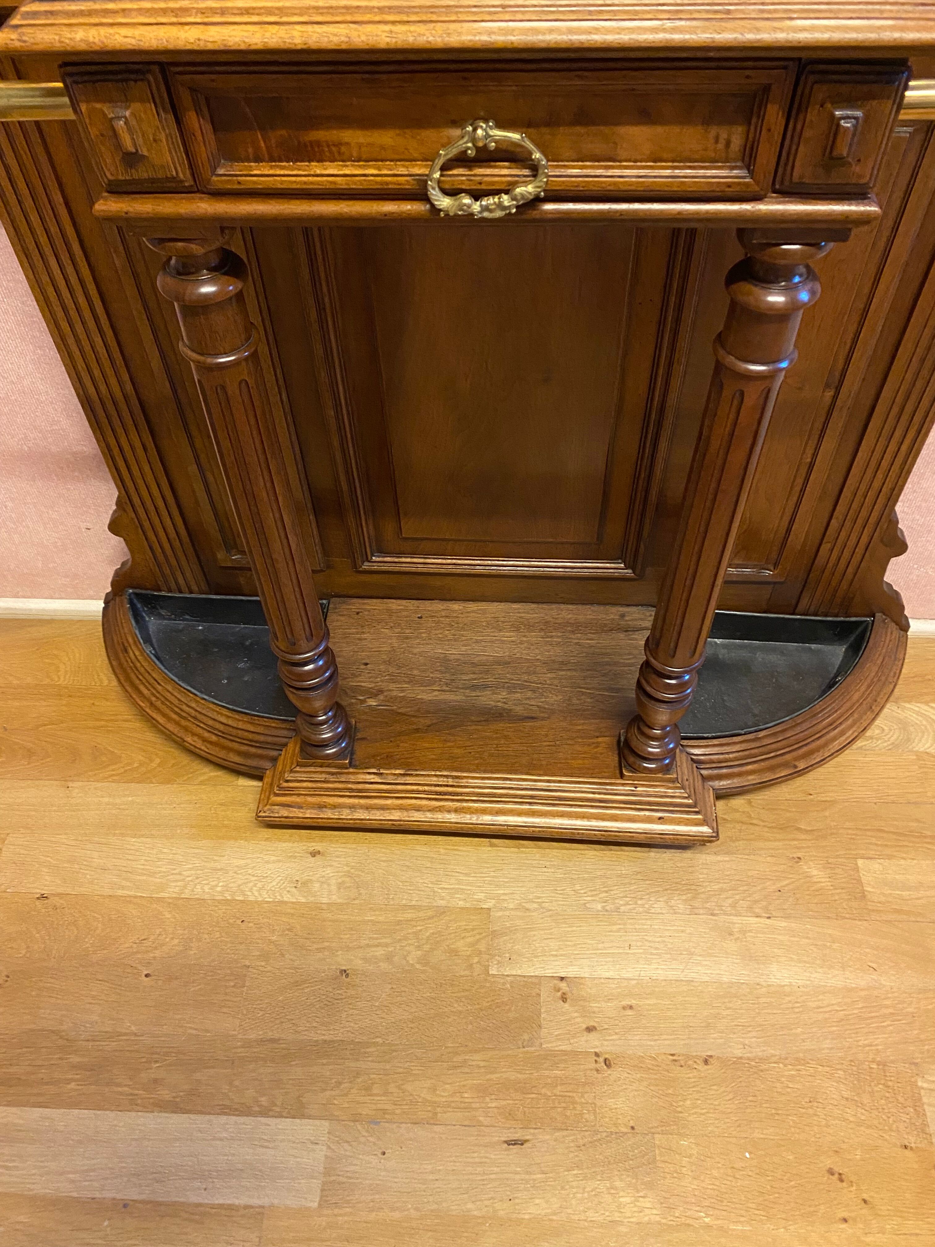 Walnut coat rack and brass hooks
