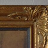 Old large wall frame in gilded carved wood