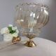 Table lamp with gold metal base, vintage amber globe