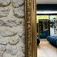 Antique mirror 183.5/116cm with pediments and pearl detailing in gold leaf.
