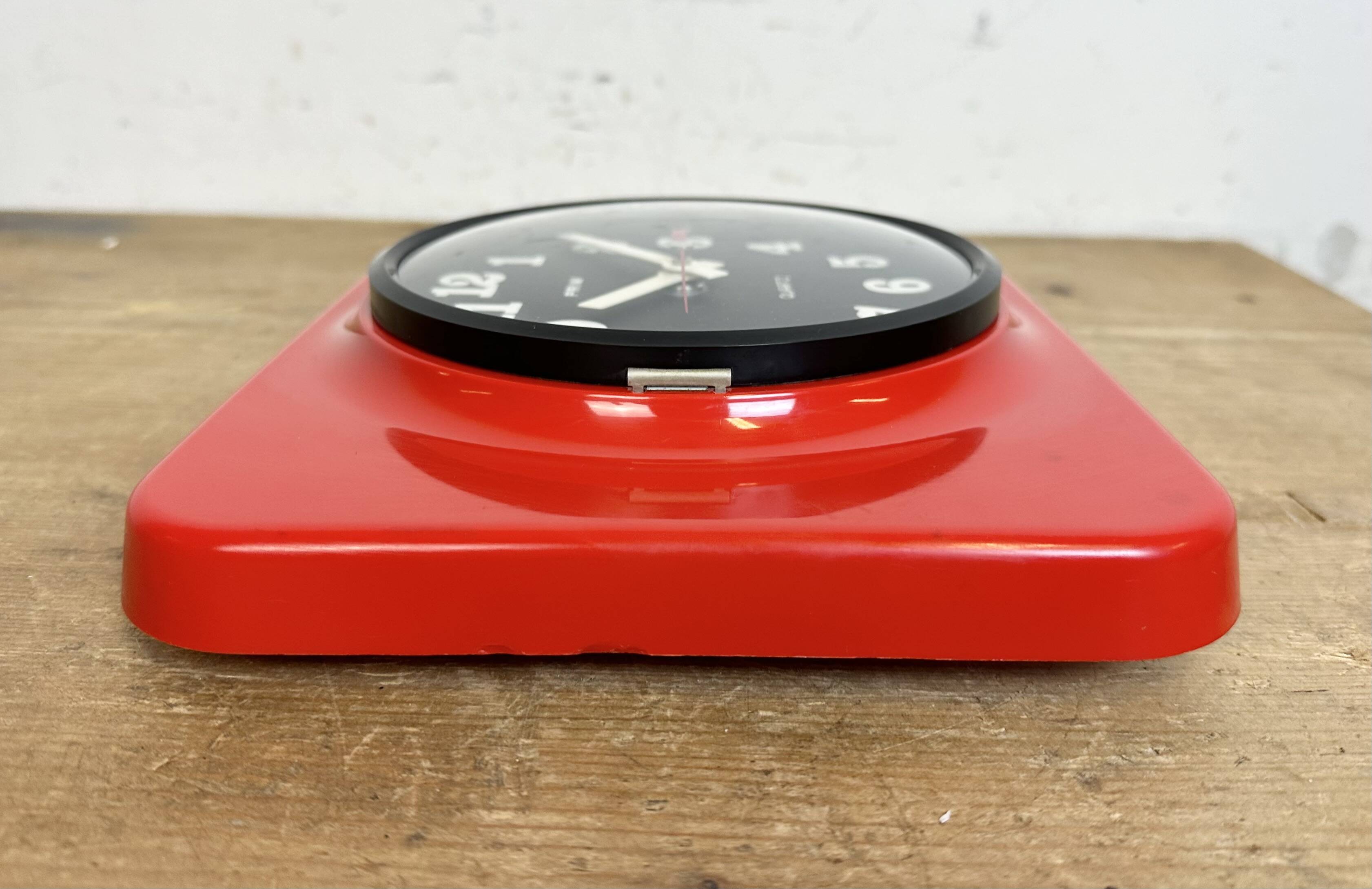 Vintage red bakelite wall clock from prim, 1970s