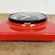 Vintage red bakelite wall clock from prim, 1970s
