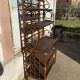 Wicker stand with scrolls shelf