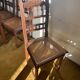 6 carved wooden chairs with cane seats