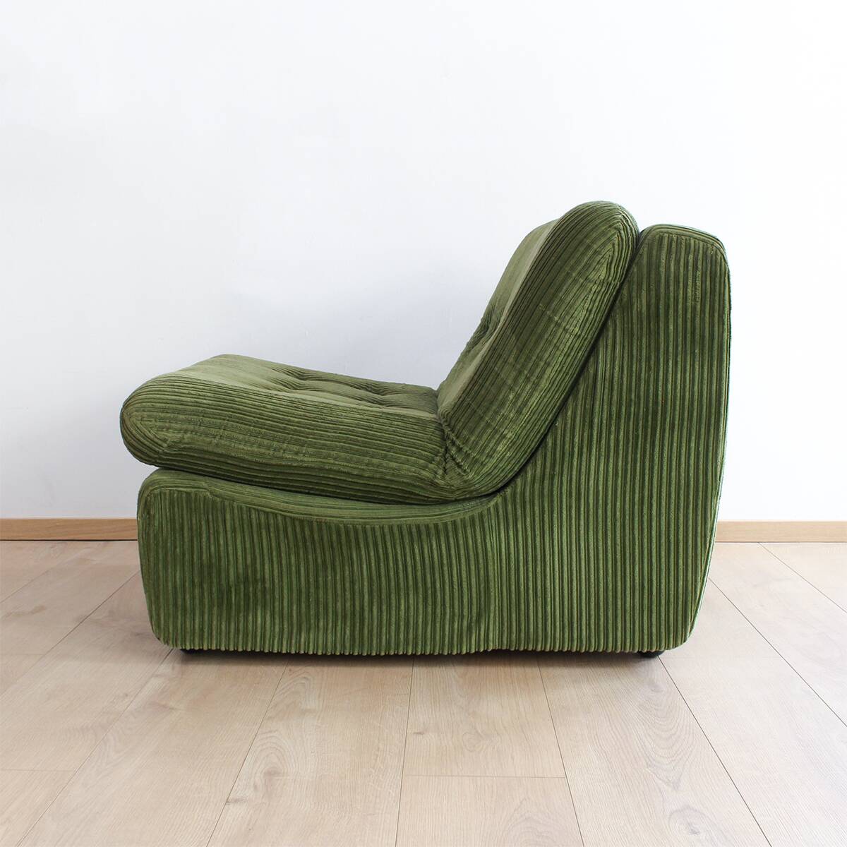 Modular vintage sofa with green cord upholstery