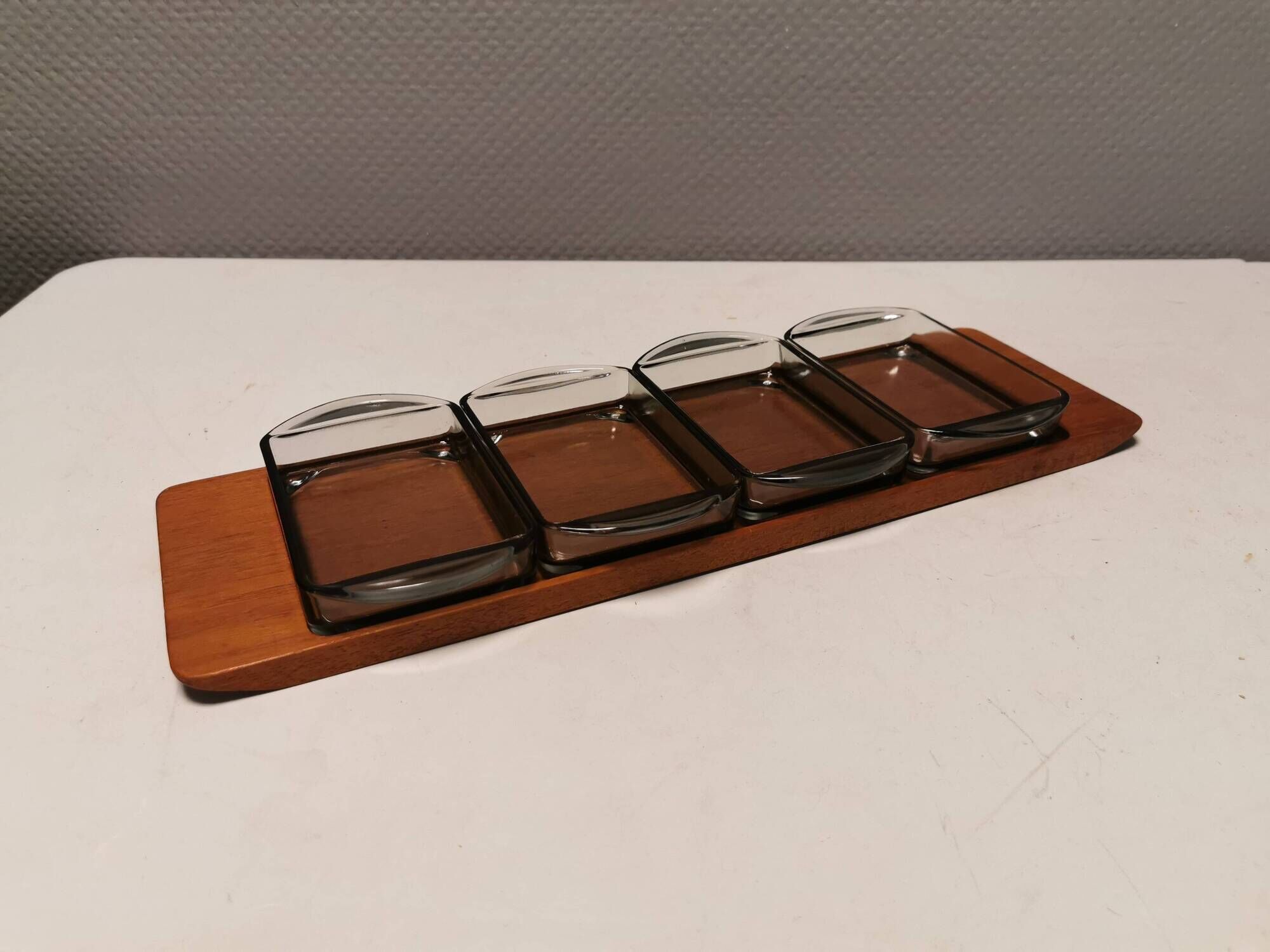 Teak Cabaret tray with four smoke coloured glass bowls, Danish and produced by Wiggers 1970s.
