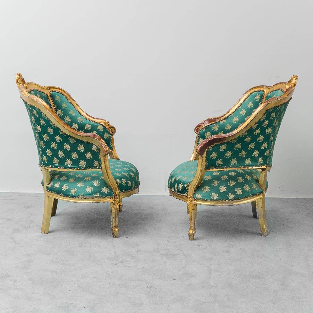Pair of Louis XV style gilded armchairs with vintage green fabric