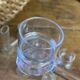 Knife rests, flower vases and candle holders in blown glass.