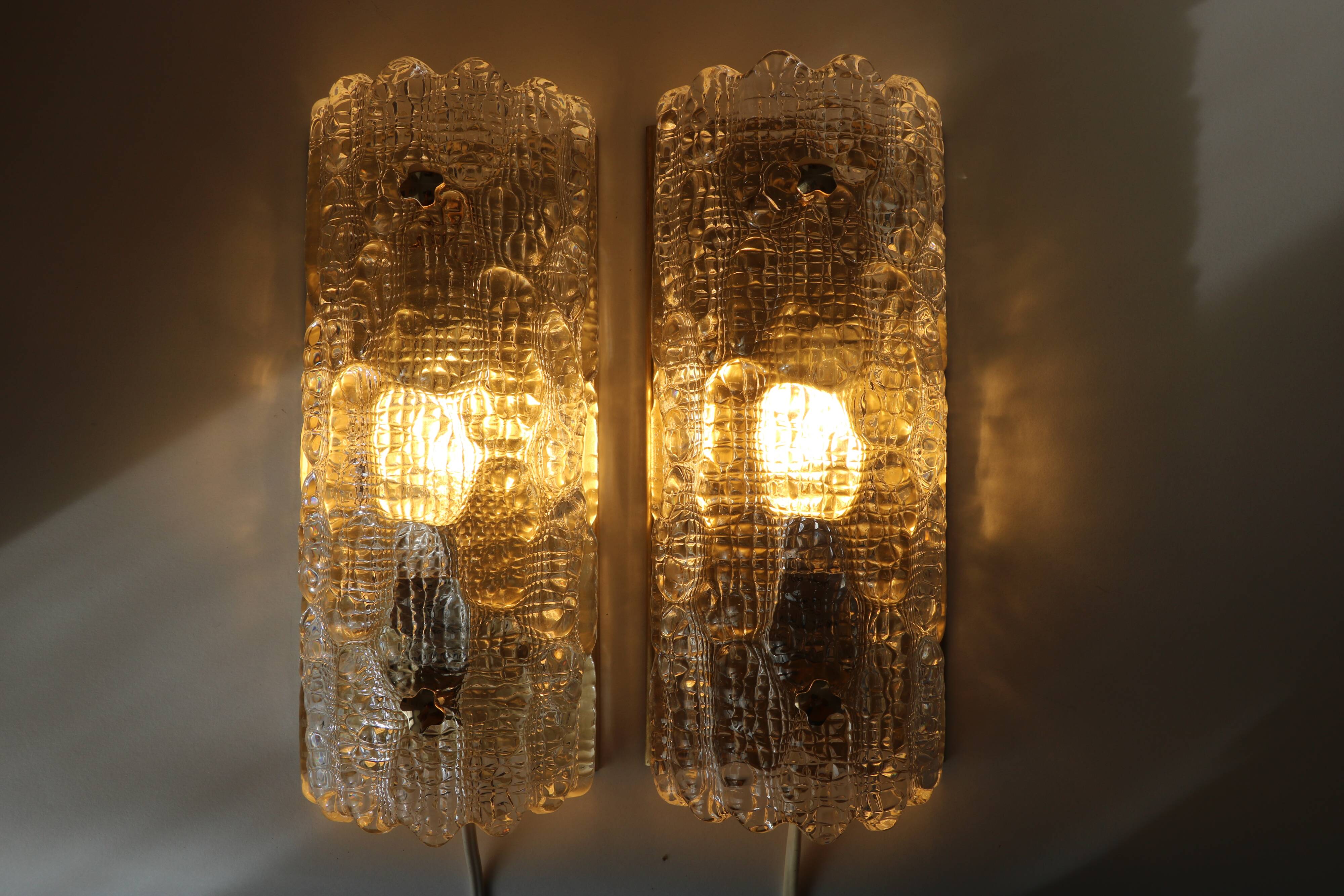 Pair of glass and brass wall lights by Carl Fagerlund for Orrefors, 1960.