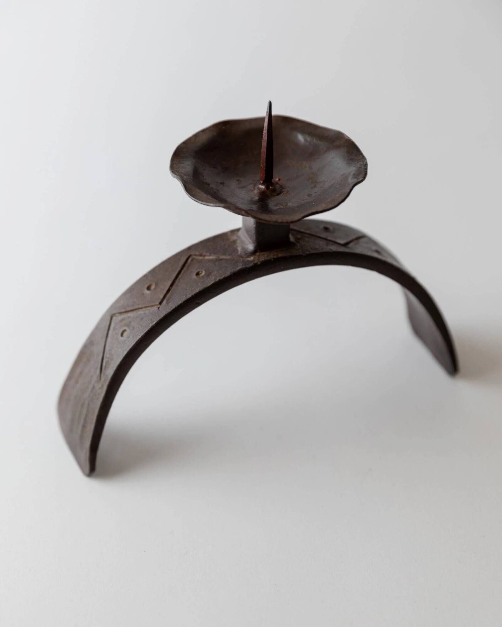 Vintage wrought iron candlestick from the 1960s, sculptural relief pattern for pillar candle, rustic Mid-Century metal, elegant gift idea.